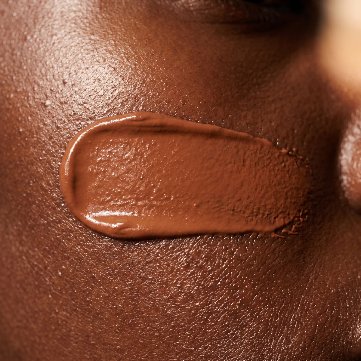 Skin tint texture macro on deep skin